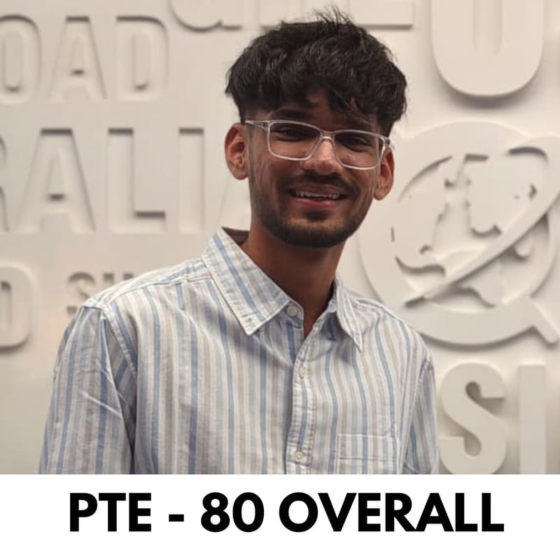 EEC student smiling in front of the EEC wall after scoring PTE 80 overall